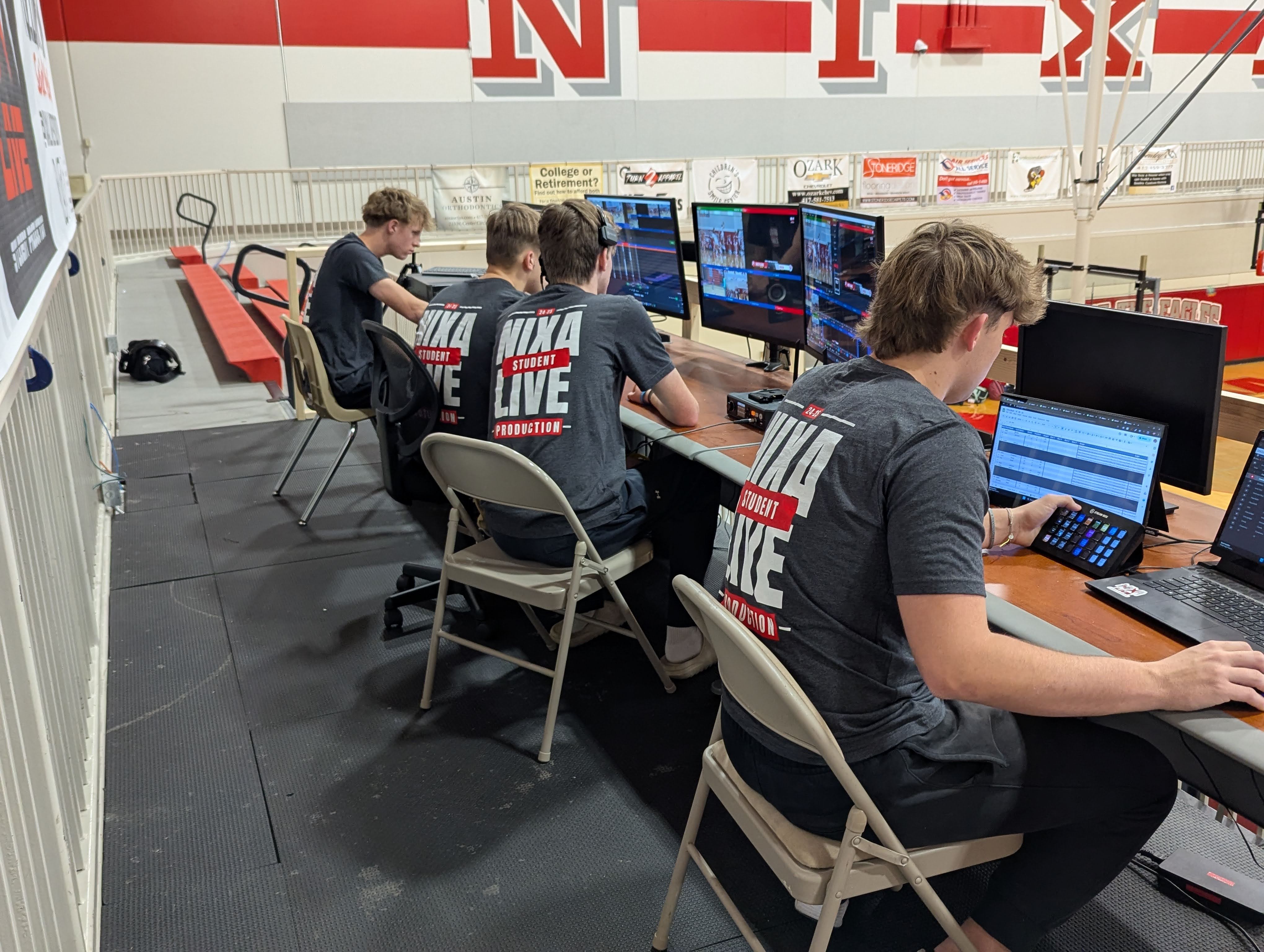 Nixa LIVE crew member directing replay and graphics in the control room